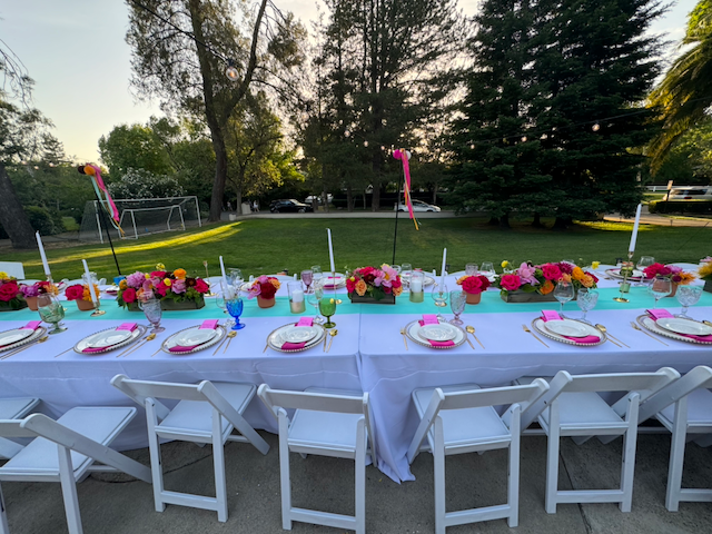 Colorful seasonal arrangement with roses, lilies, and complementary blooms